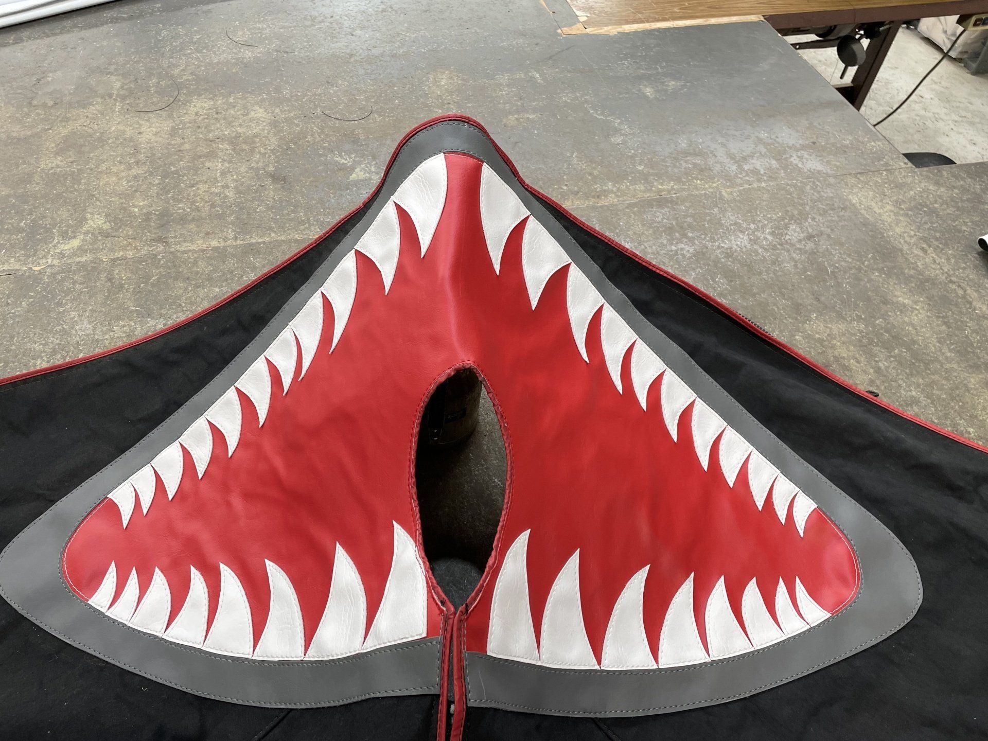 Hand cut and sewn jaws design on boat bag cover