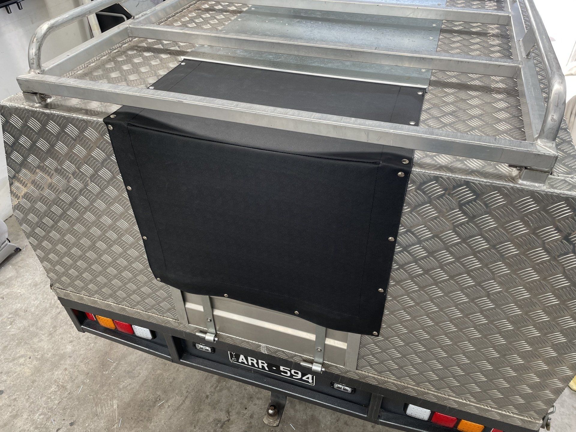 Mini tonneau cover between tool boxes