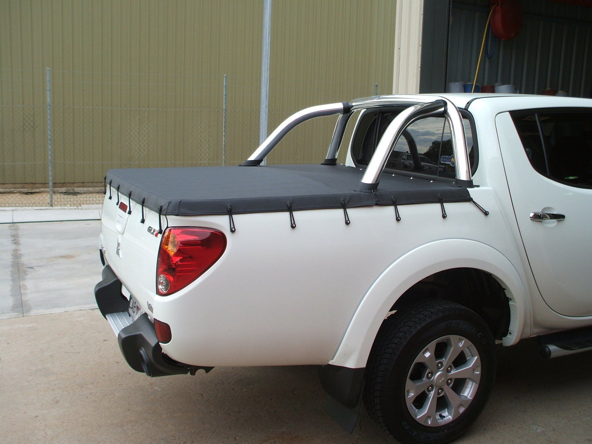 Mitsubishi Triton Ute With Sports Bars Tonneau Cover