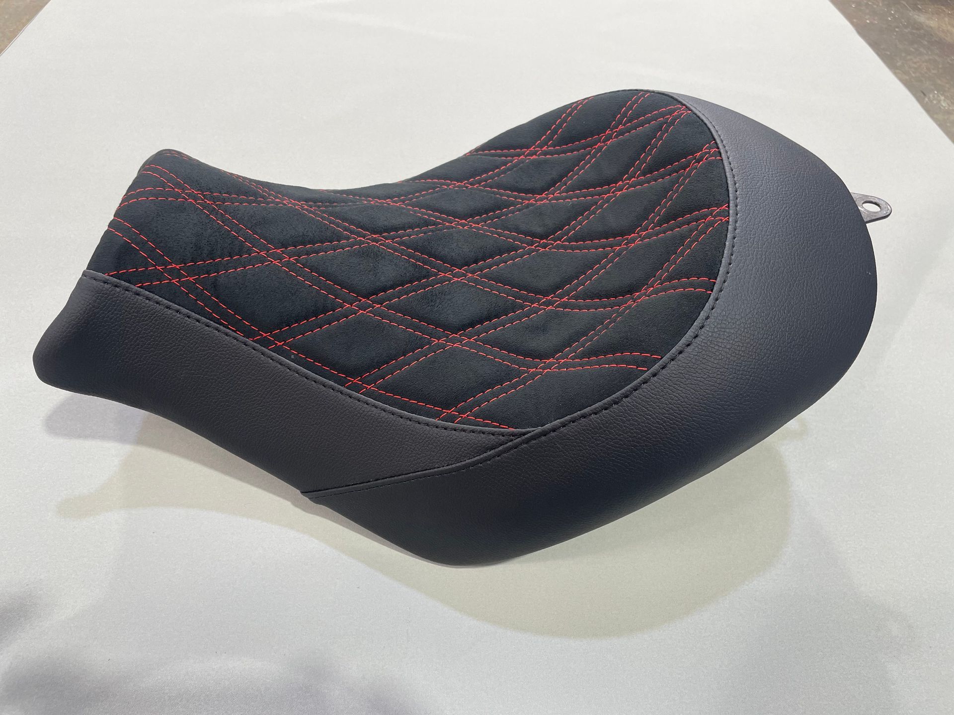Motorbike seat black vinyl and suede with red double cross stitch