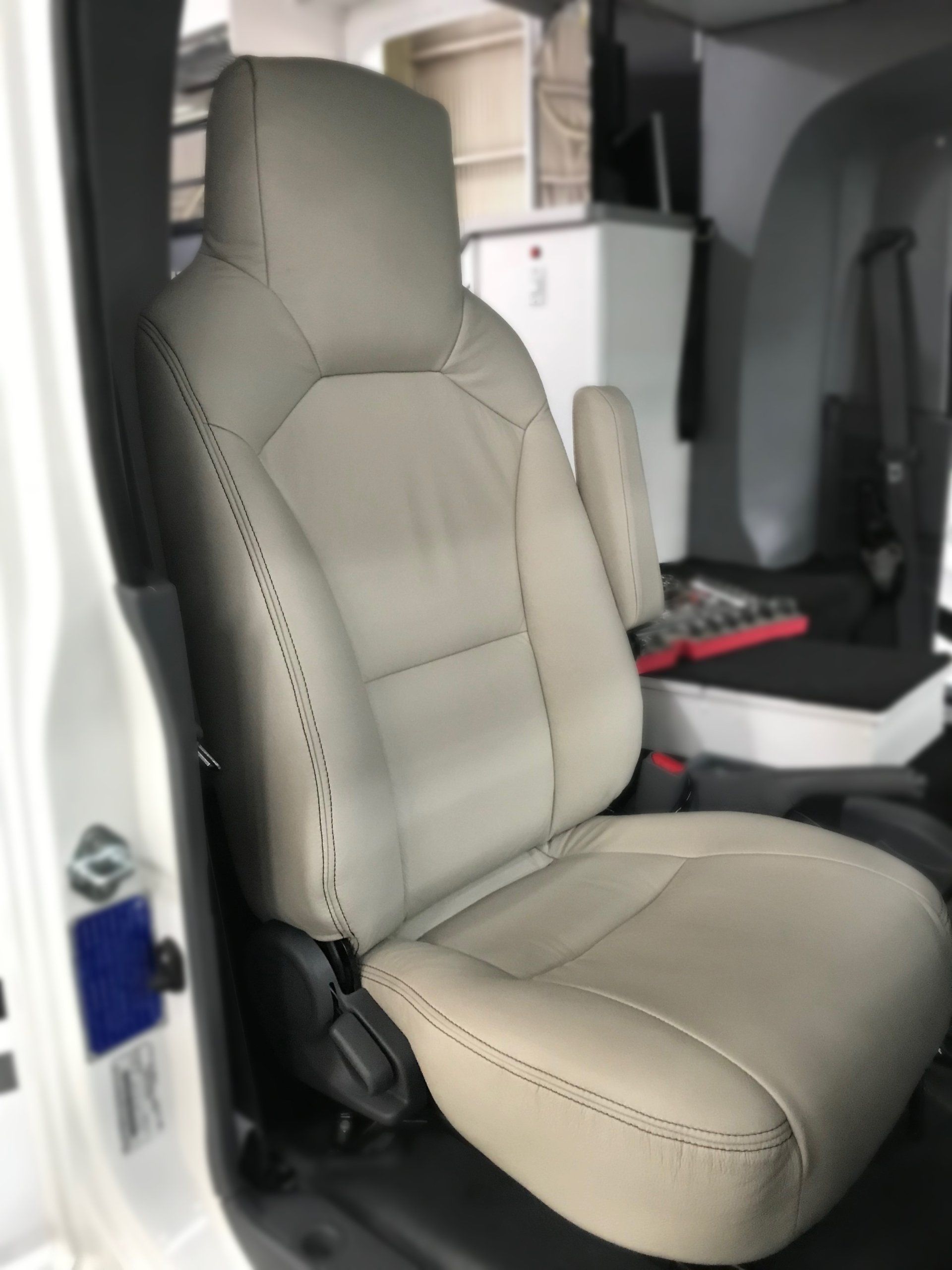 Motorhome front seat in cream leather