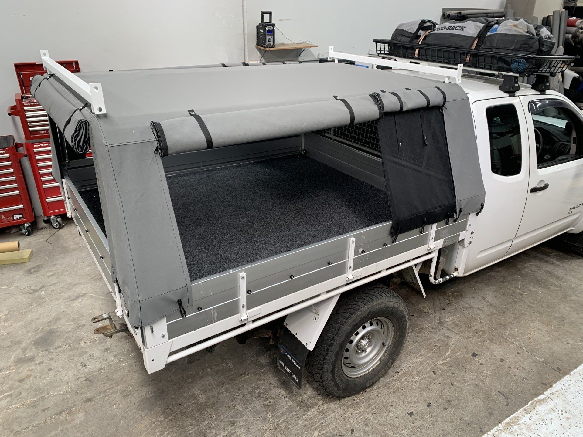 Navara RX canvas canopy with split side openings and mesh