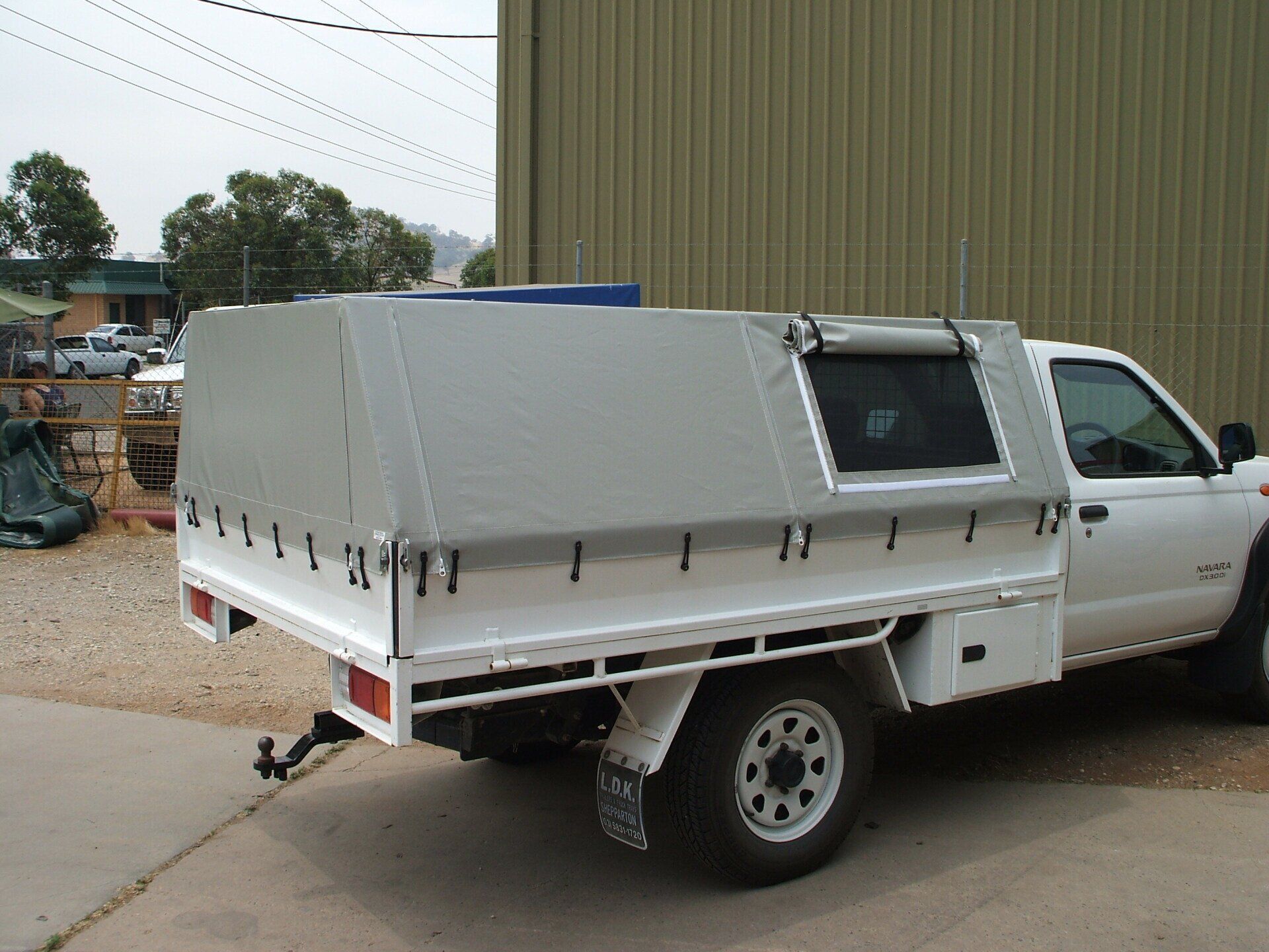 Navara with Grey PVC Canopy and Side Mesh Windows