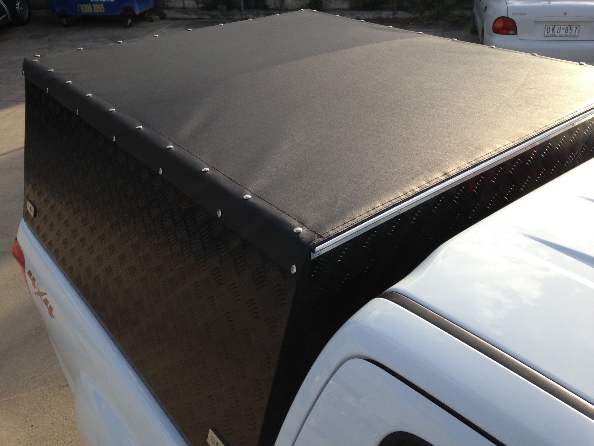 Press stud roof cover