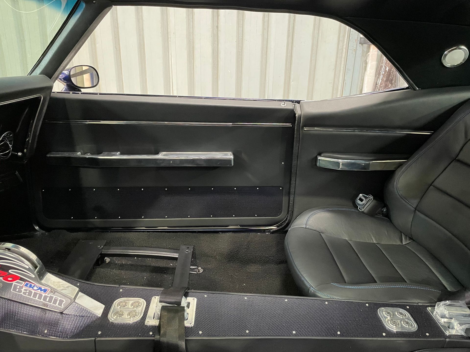 SS Camaro leather rear seat customised to single bucket seat style with door trim