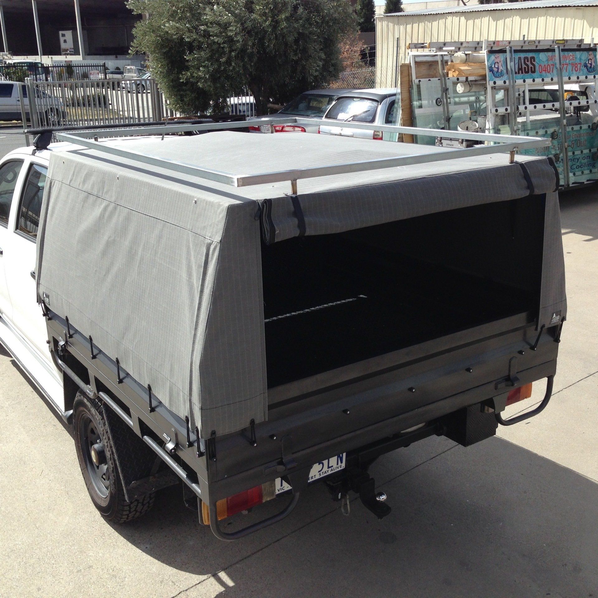 Steel ute tray with canvas canopy and carry bars
