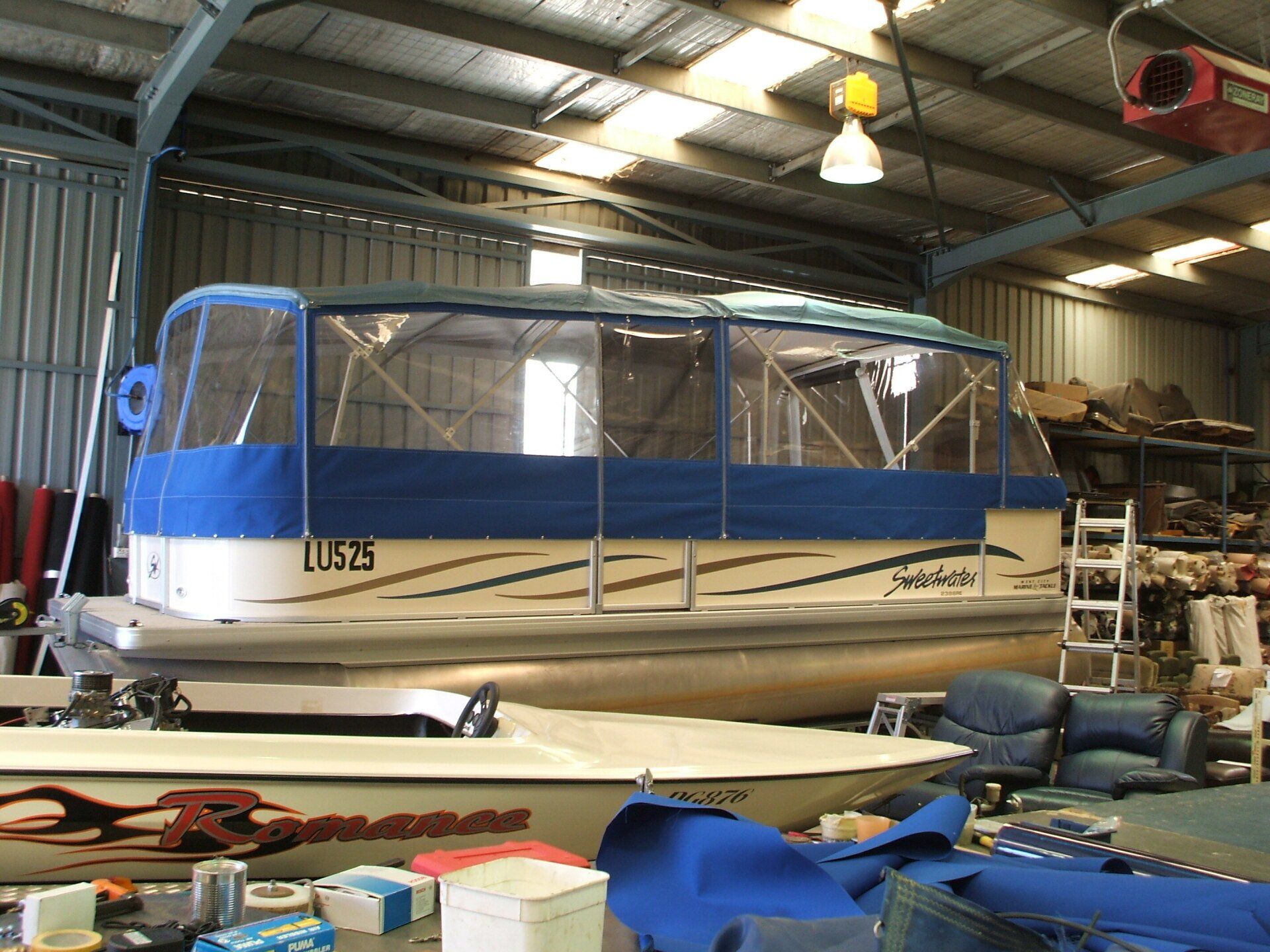 Sweetwater Pontoon Boat with Twin Biminis and Full Clear Curtains