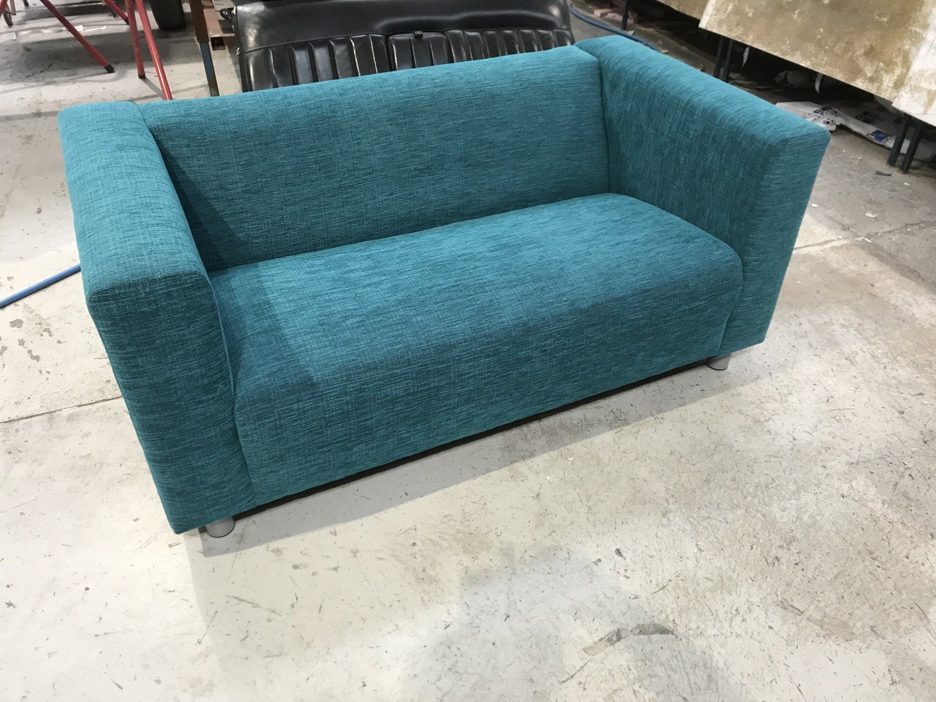 Teal two seater sofa