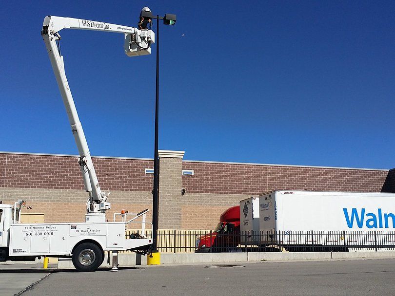 Worker Repairing Pole Lights — West Valley City, UT — GLS Electric