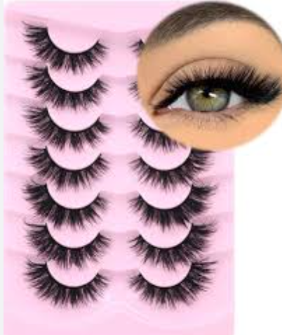 A close up of a woman 's eye with false eyelashes.