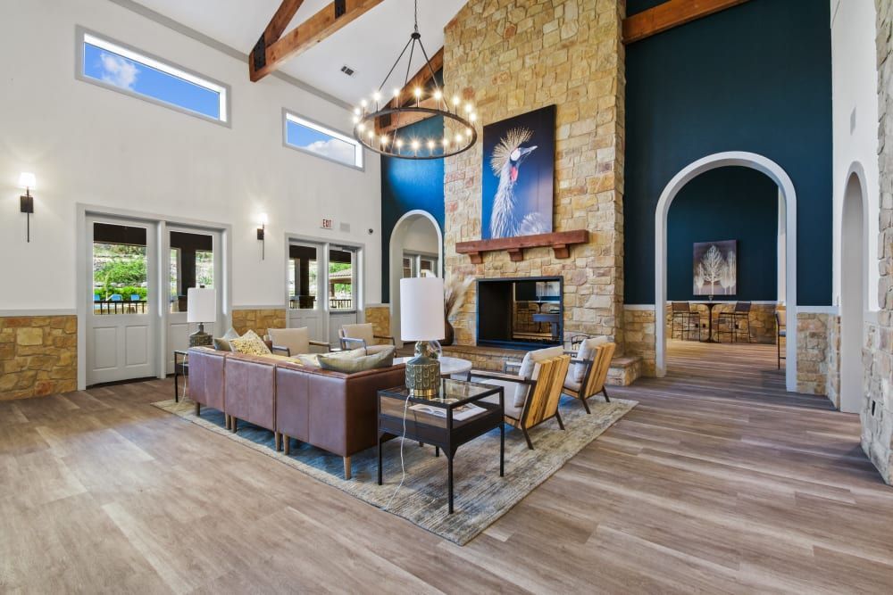 a living room filled with furniture and a fireplace at Marquis on Evans in San Antonio, TX.
