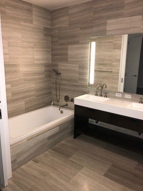 A bathroom with a bathtub and a sink