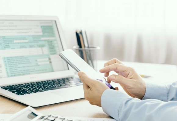 accountant checking his notepad