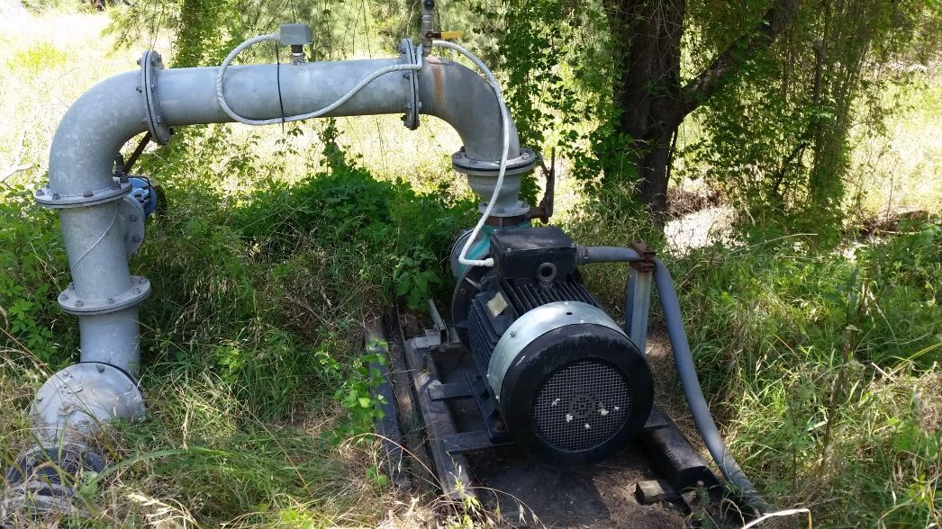 Pump On A Grass — Electrician in Upper Hunter Region, NSW