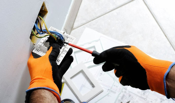 Electrician Working Safely On Switches & Socket — Electrician in Upper Hunter Region, NSW