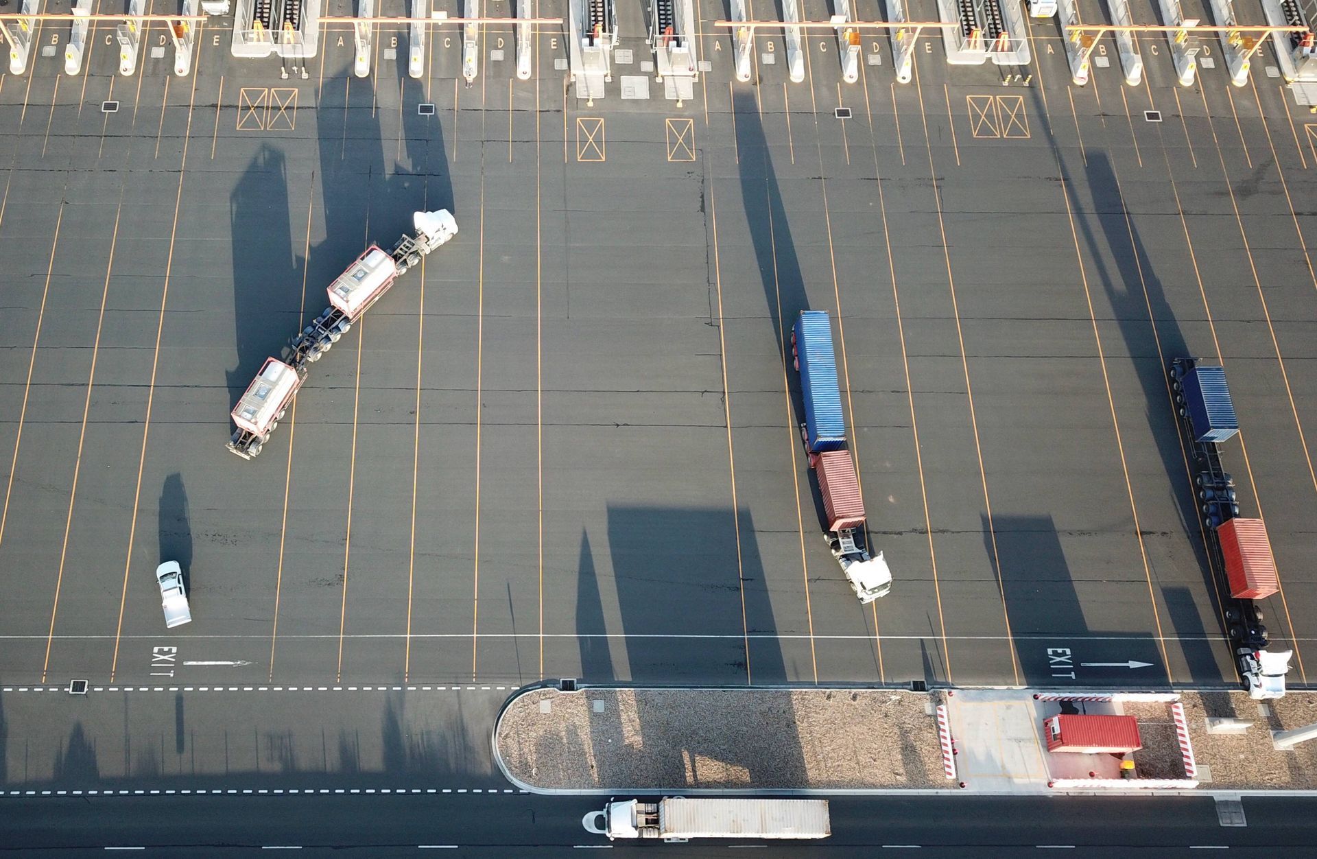An aerial view of trucks parked in a parking lot.
