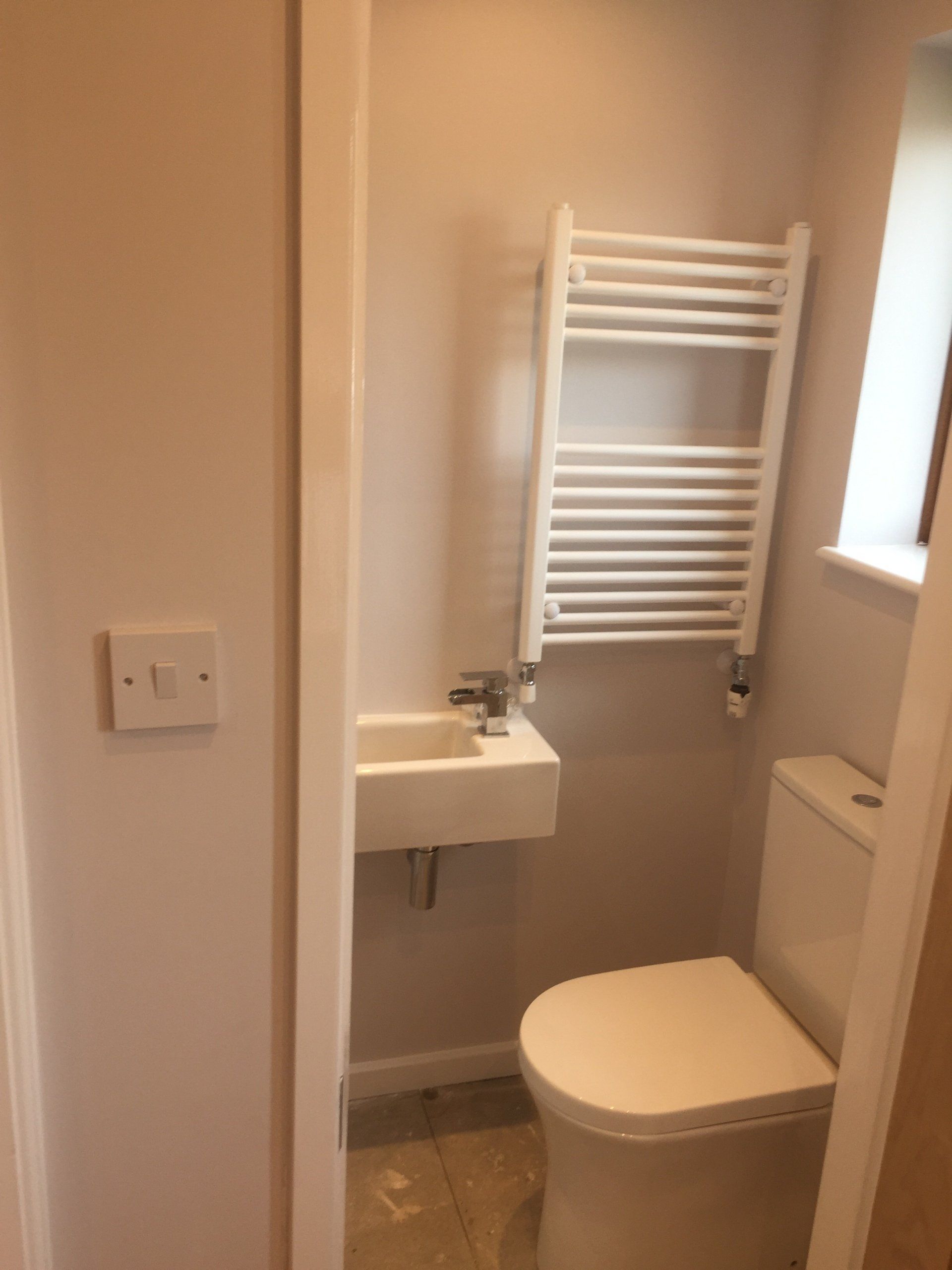 wc in garage conversion with sink and heated towel rail