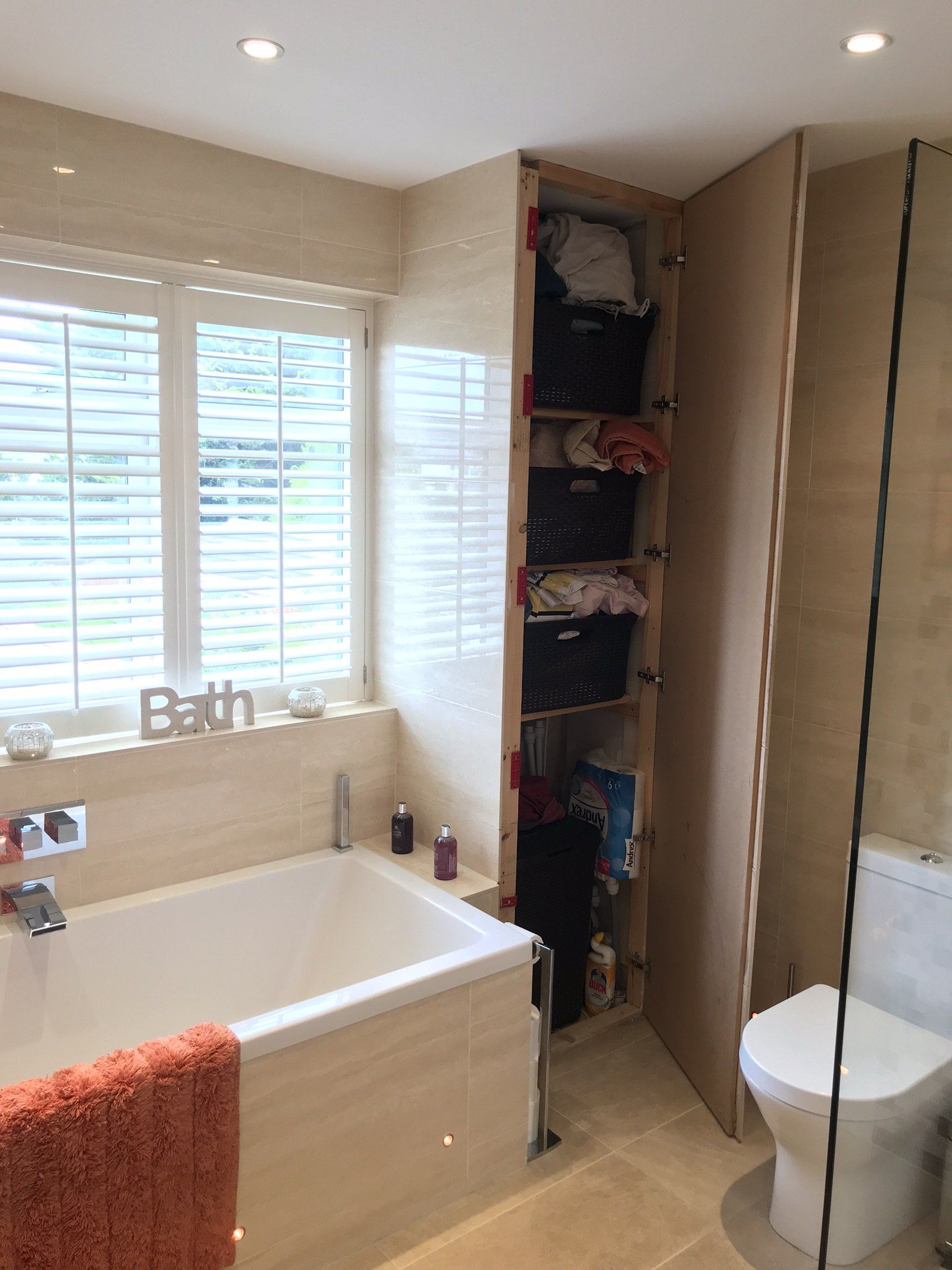 clever invisible storage in new bathroom
