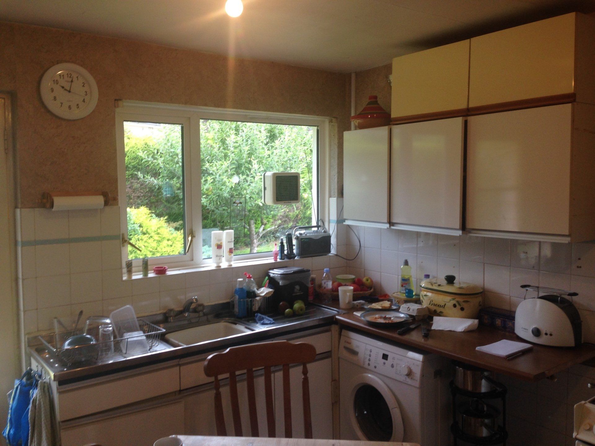 messy old kitchen before being ripped out