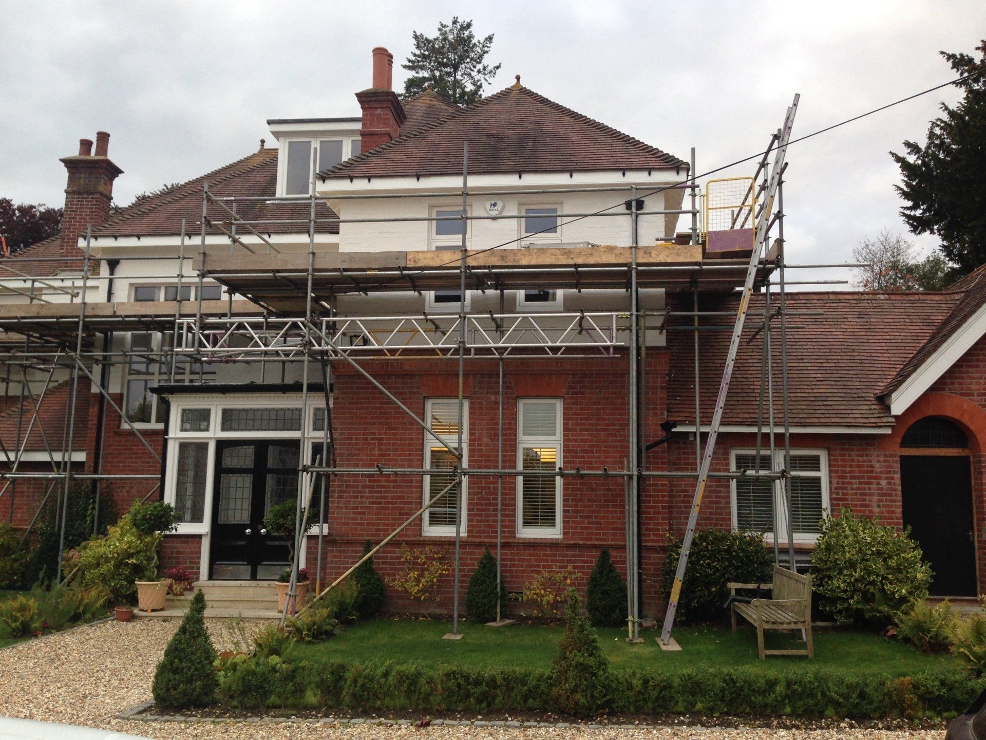 large home with scaffolding up different view