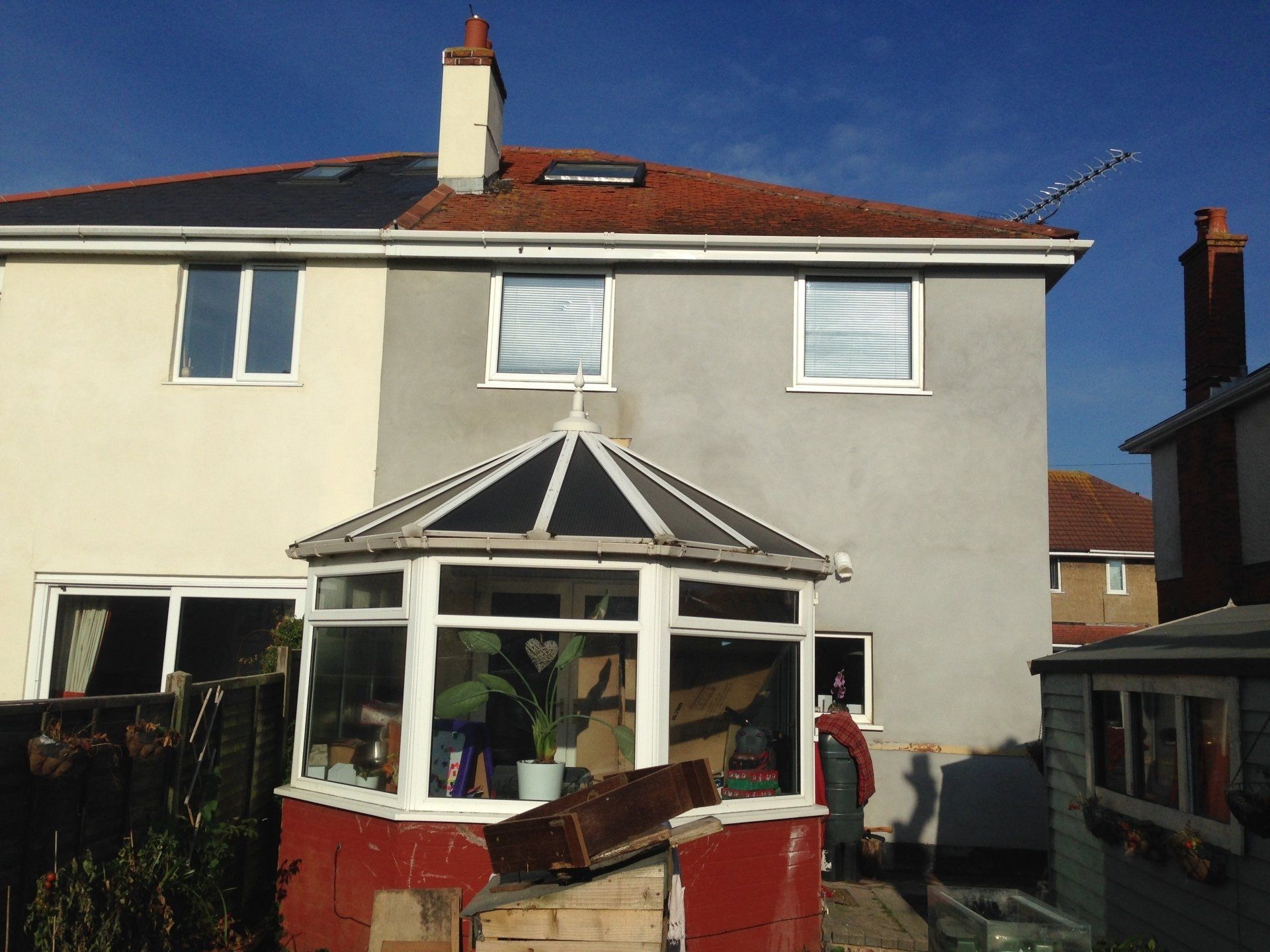 view of rear of a house with old conservatory