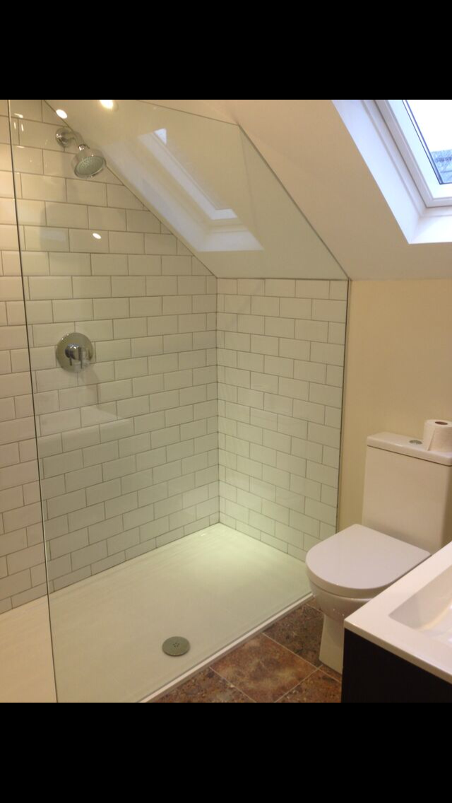 large walk in shower at one end of new bathroom