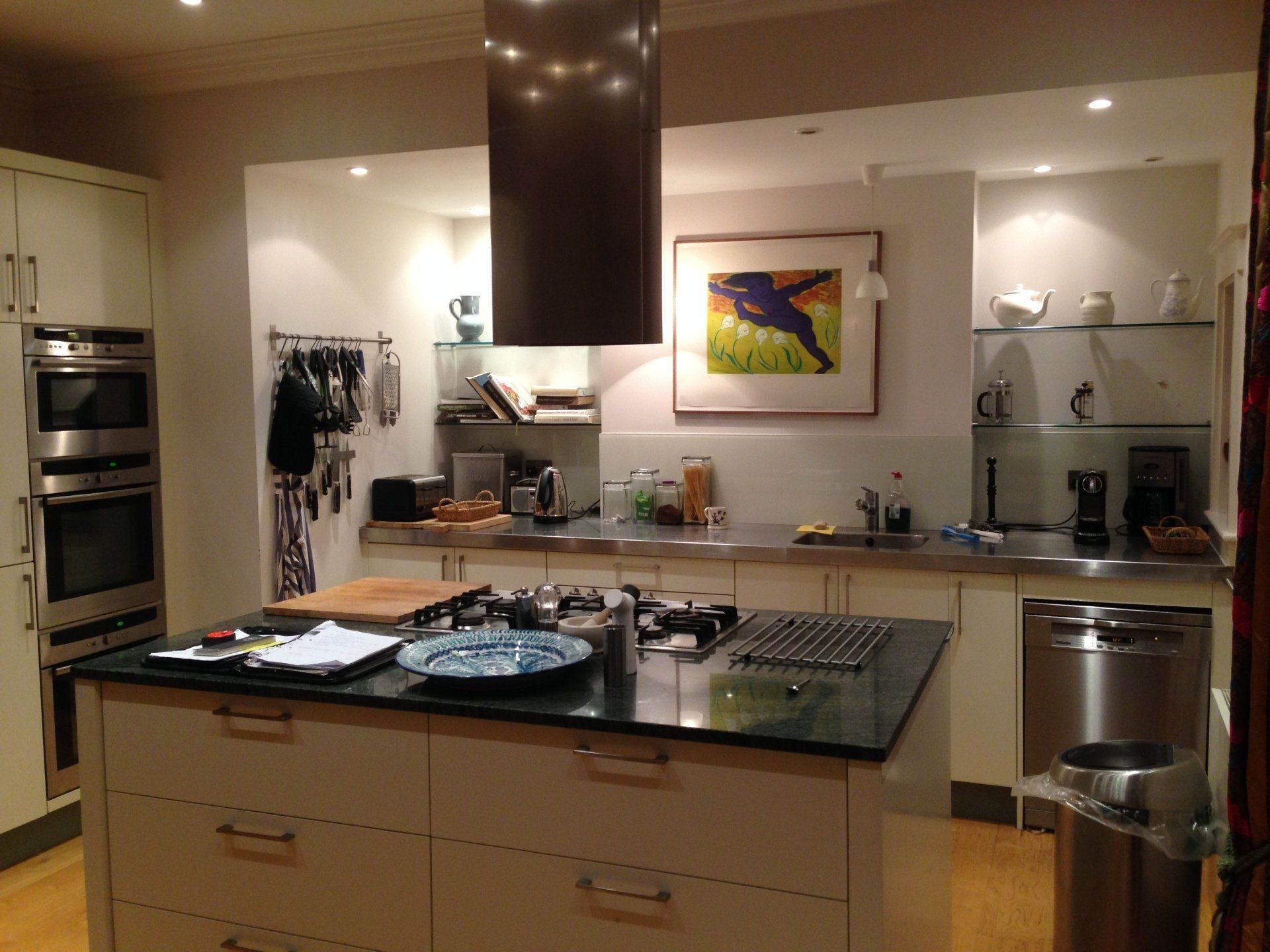 new kitchen with smart brushed steel work surfaces