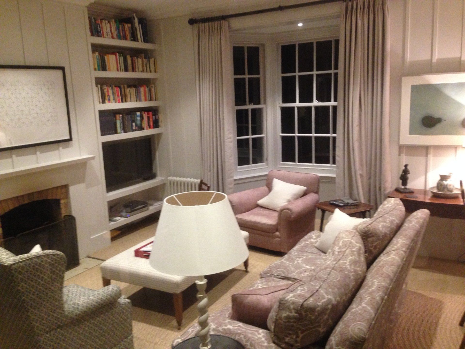 beautiful living room with large bay window and fireplace