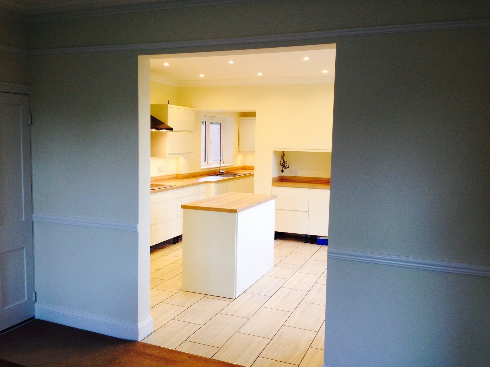 new kitchen with island empty before client puts things back in