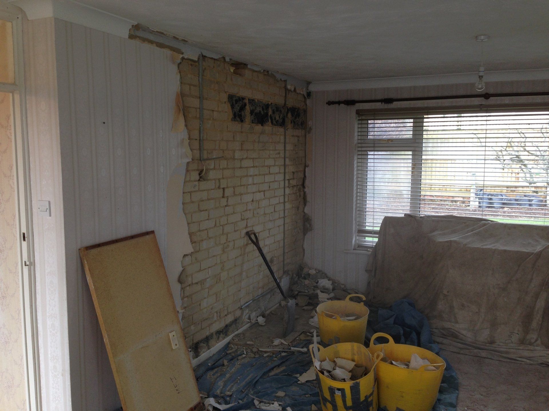 kitchen stripped back to brickwork