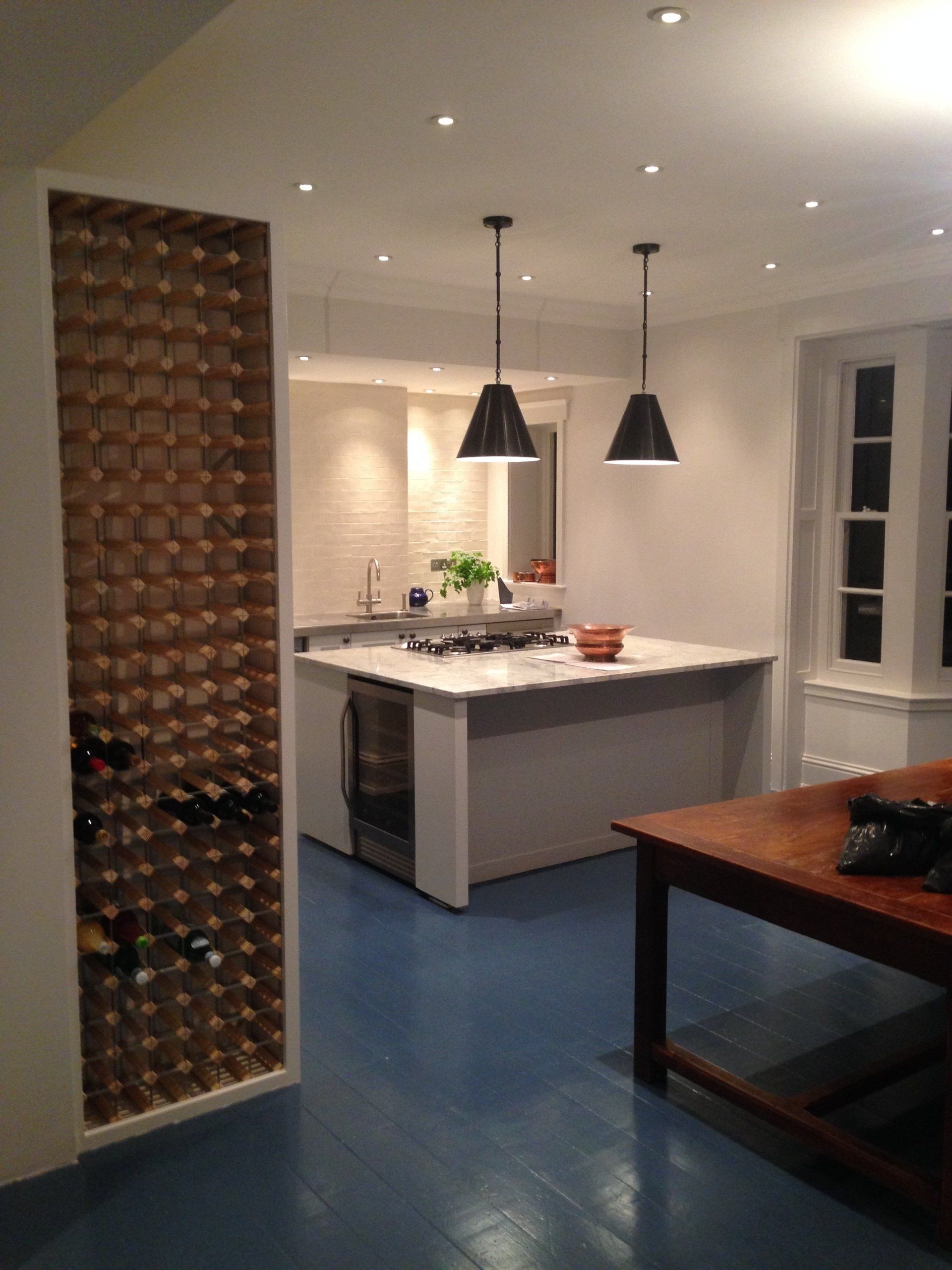 finished kitchen with big wall to ceiling wine storage