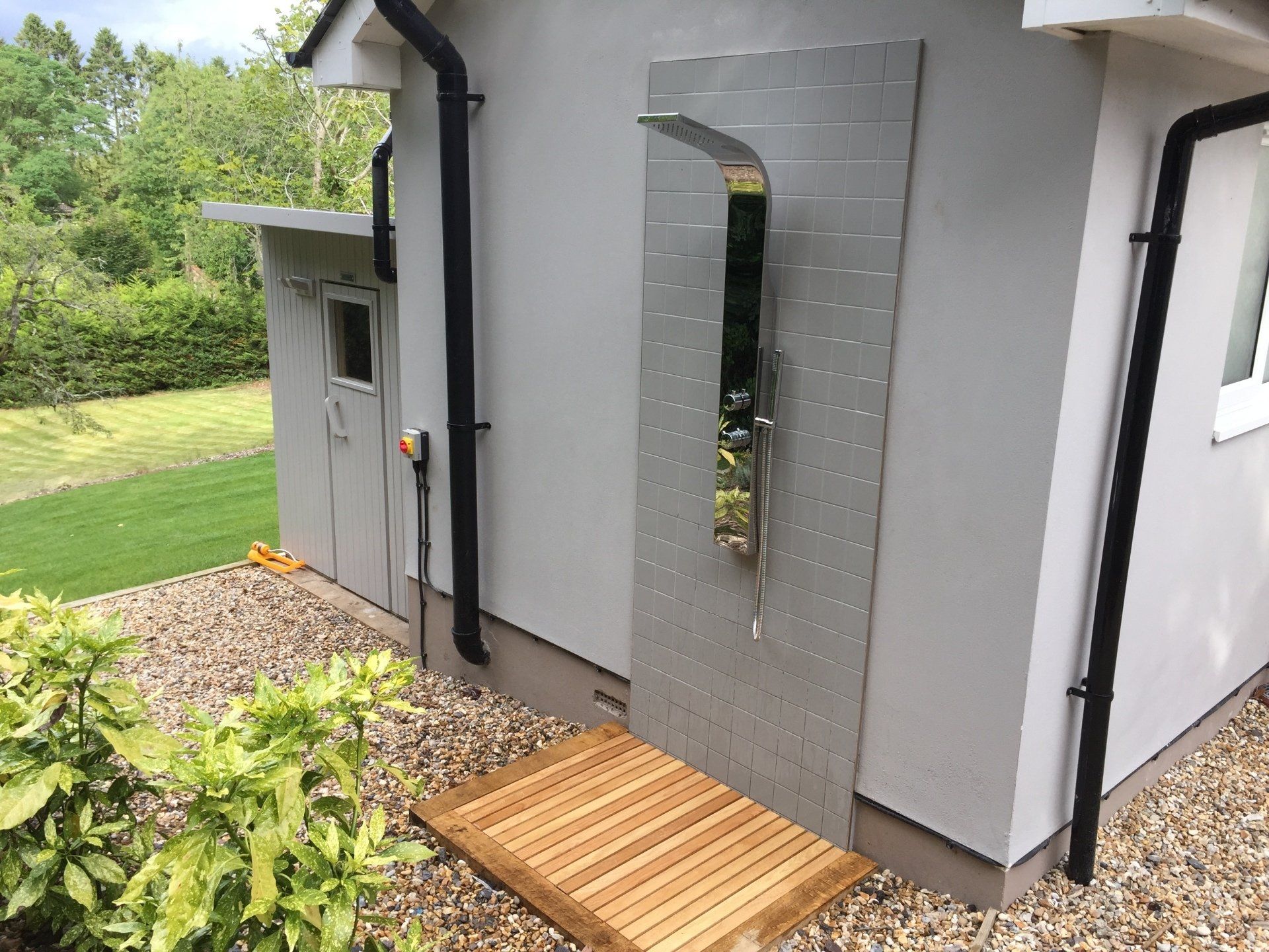 outdoor shower with wooden base