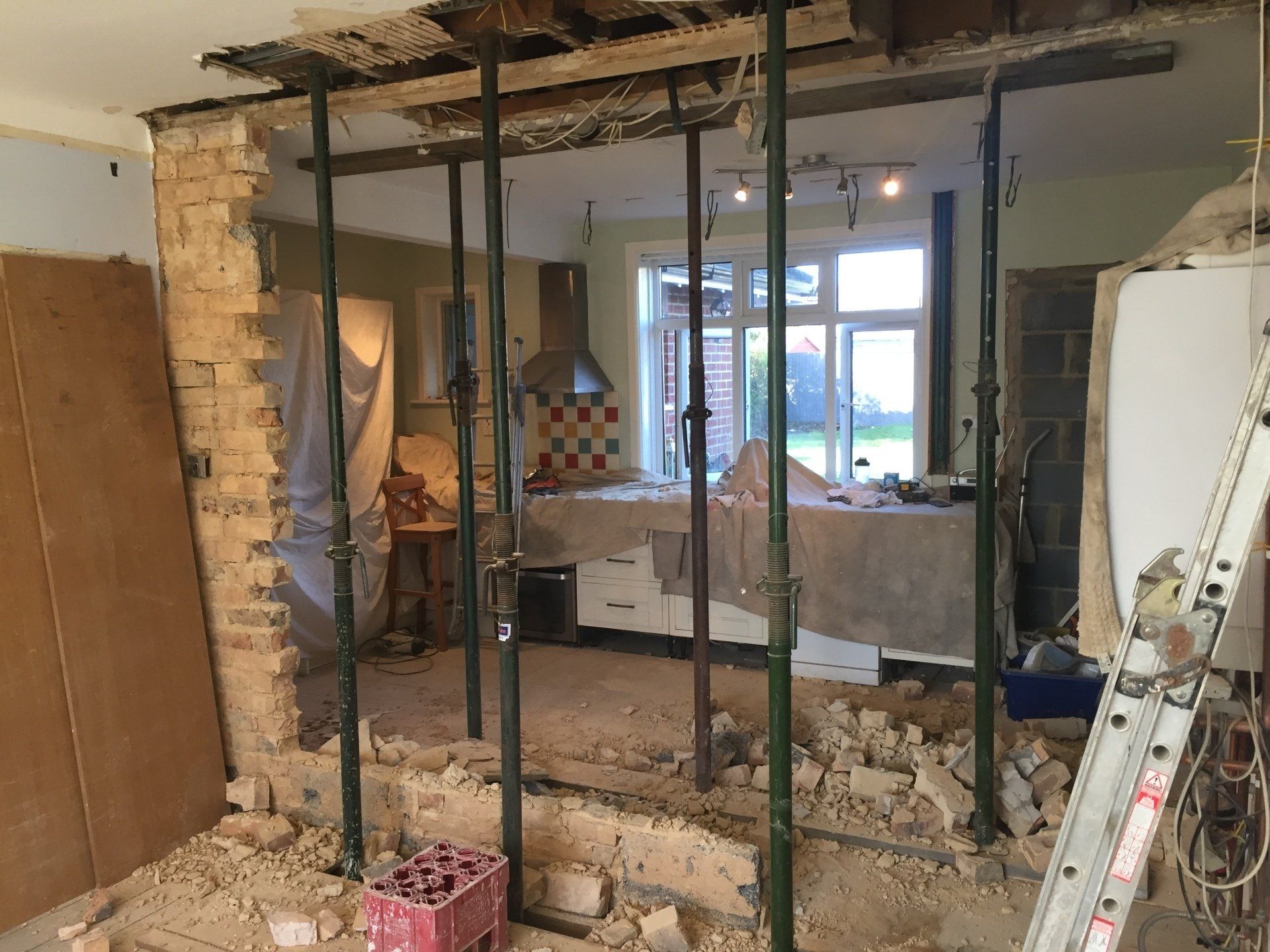 wall taken down to create walk through kitchen diner