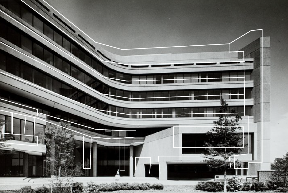 A black and white photo of a large building with a lot of windows