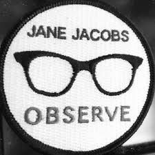 A black and white patch with a pair of glasses and the words