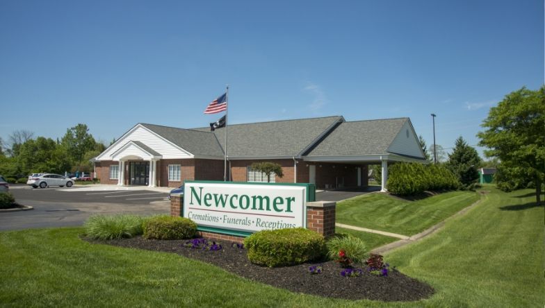a building with a sign that says newcomer on it