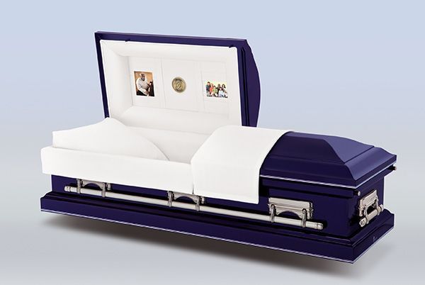 A blue and white coffin with the lid open