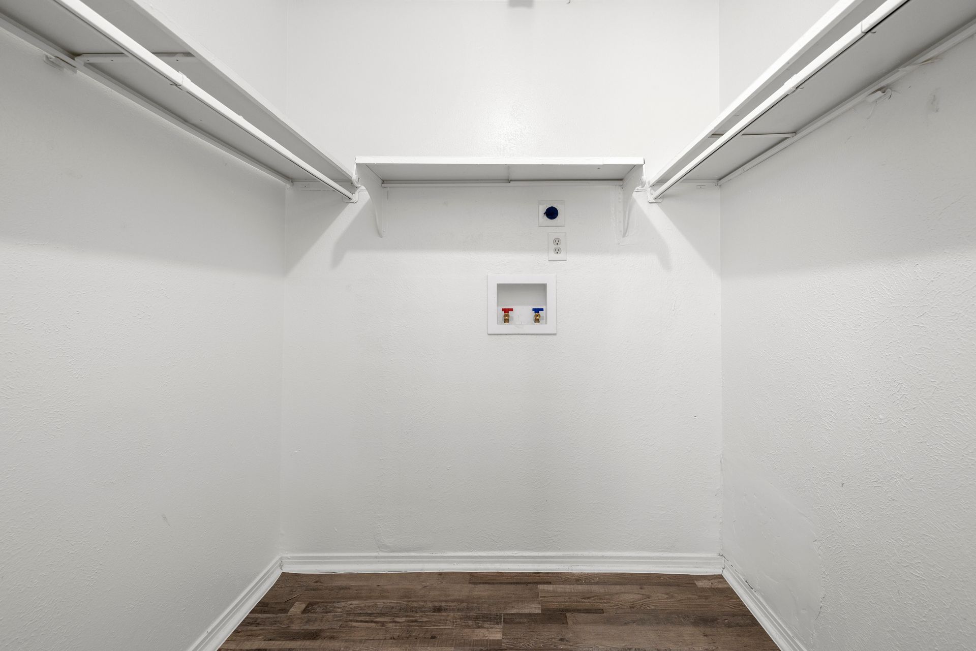 A living room with a couch , chair , coffee table and rug at Senita in Dallas, TX.