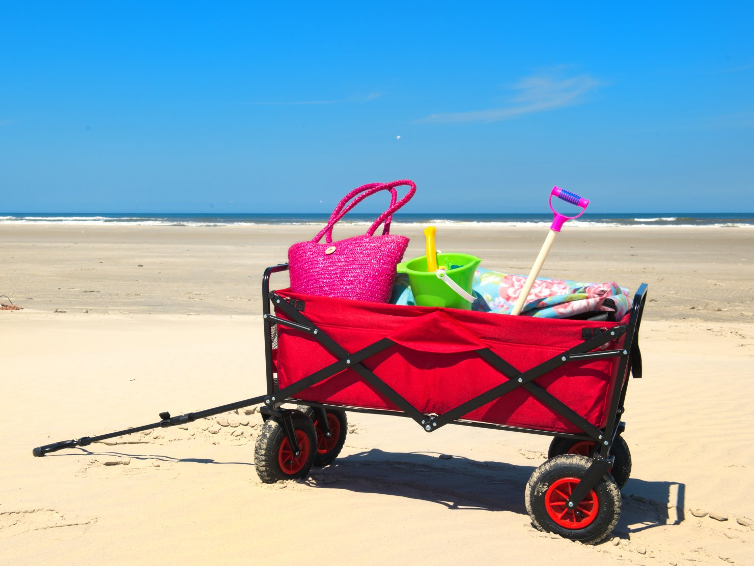cart with child's toys in the beach