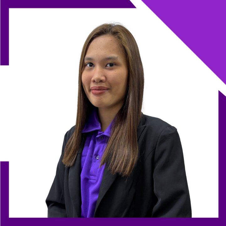 A woman wearing a purple shirt and a black jacket