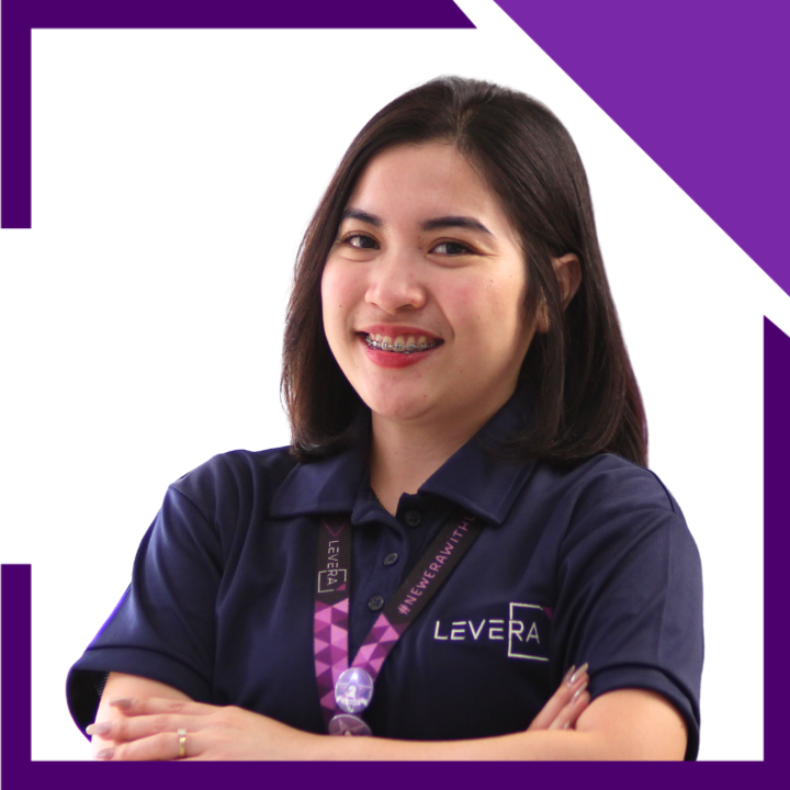 A woman wearing a purple shirt that says lev on it