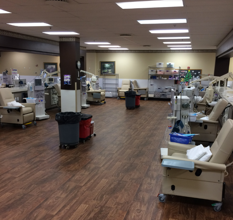 A large room with a lot of chairs and equipment