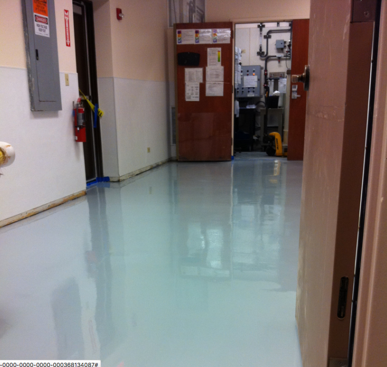 A hallway with a fire extinguisher on the wall