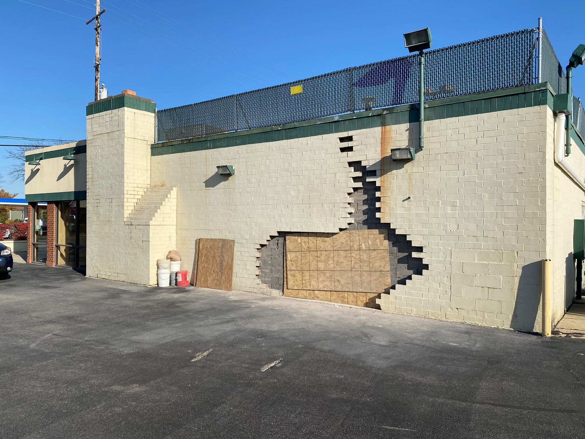 A brick building with a hole in the side of it