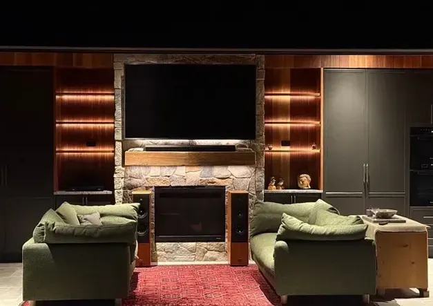 A Living Room With a Fireplace and a Flat Screen TV — Mylec Electrical Solutions in Shell Cove, NSW