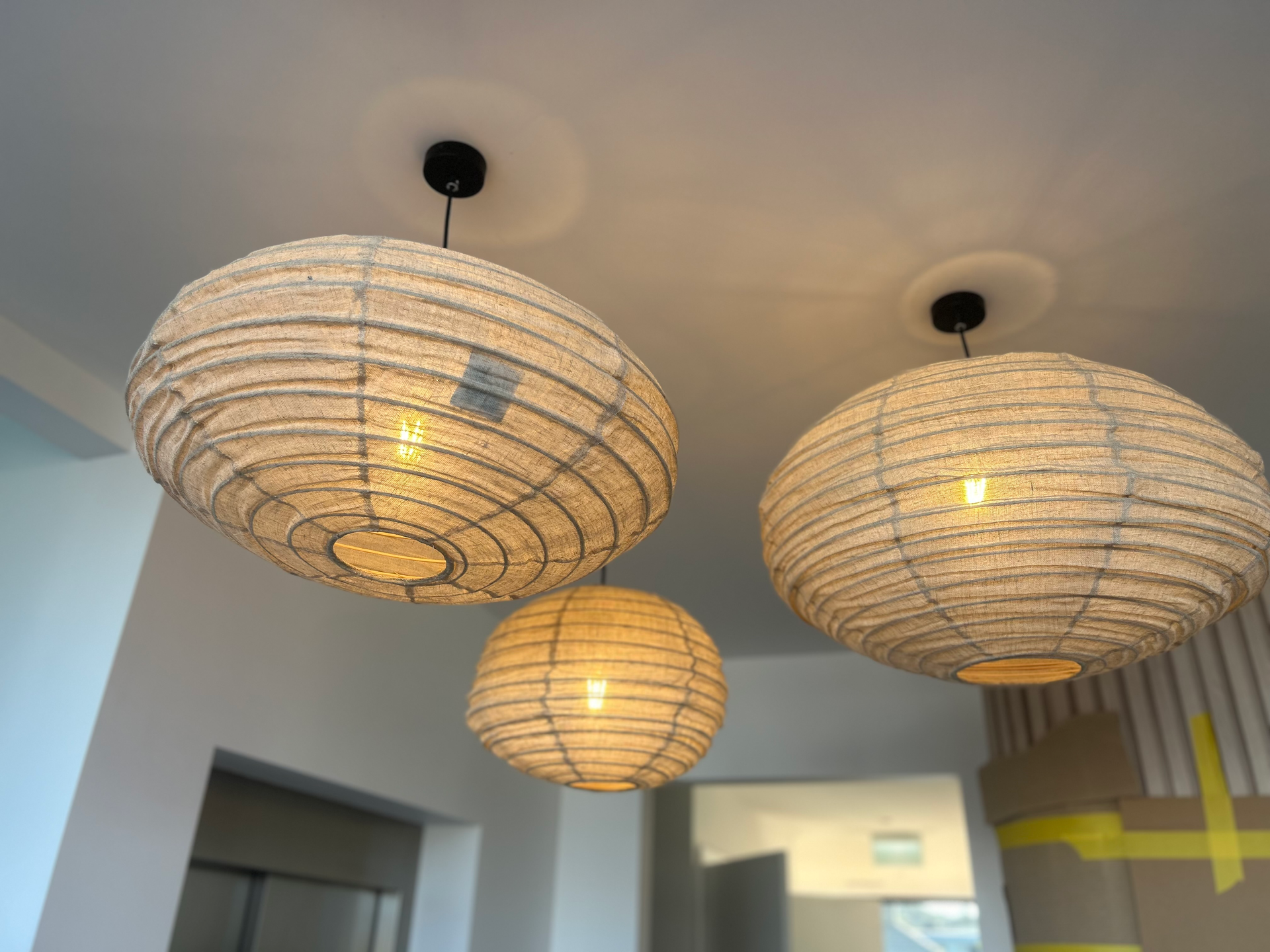 A Kitchen With White Cabinets, a Stove, and a Large Table— Mylec Electrical Solutions in North Wollongong, NSW