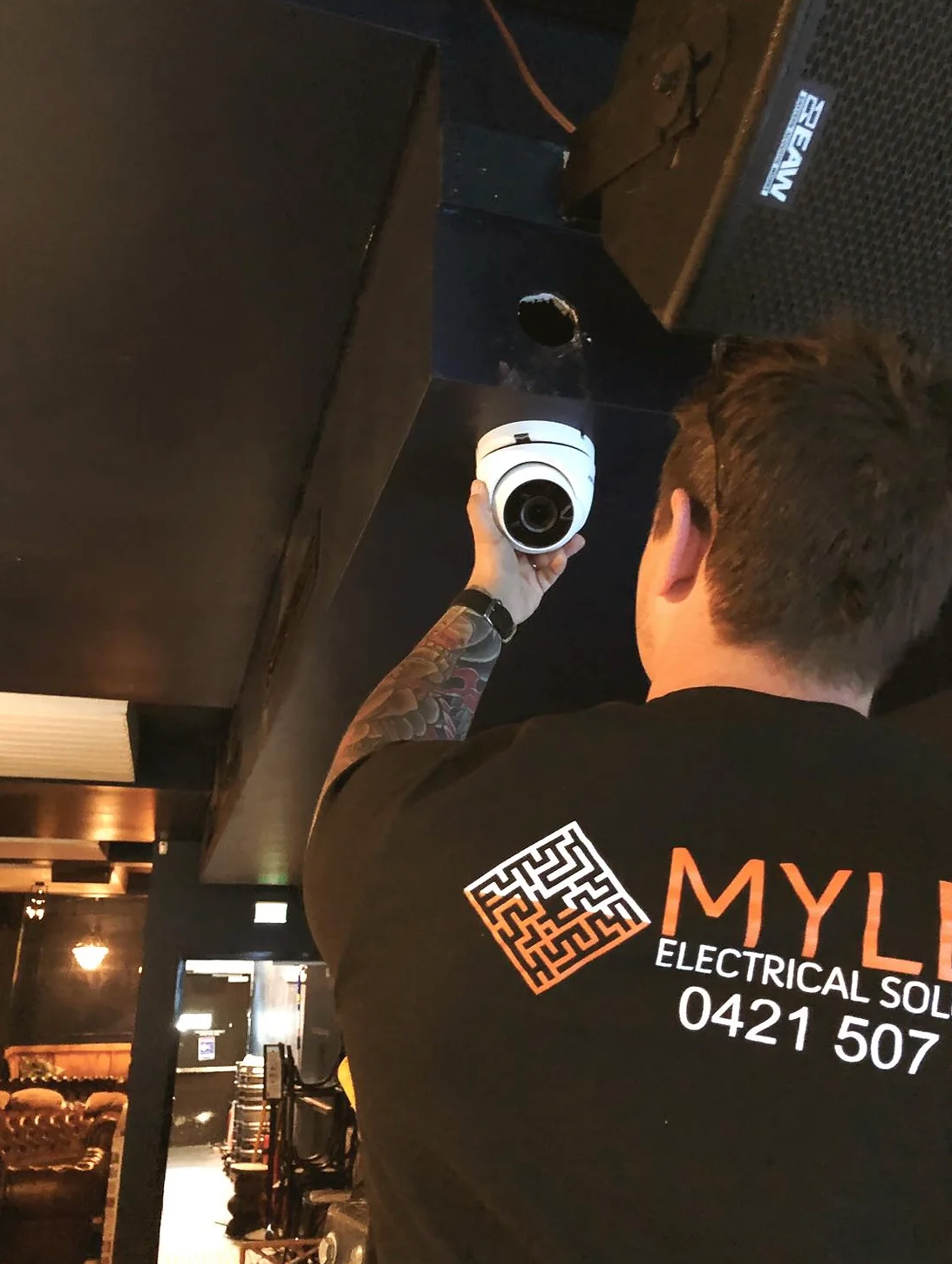 A yellow device is plugged into a wall outlet — Mylec Electrical Solutions in Shell Cove, NSW