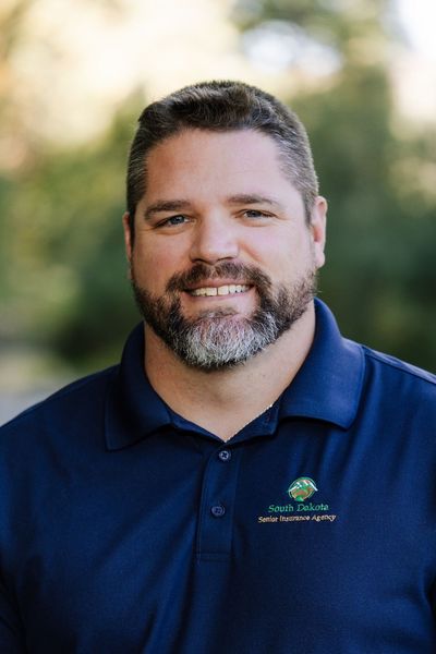 Agent Kevin is smiling for the camera.