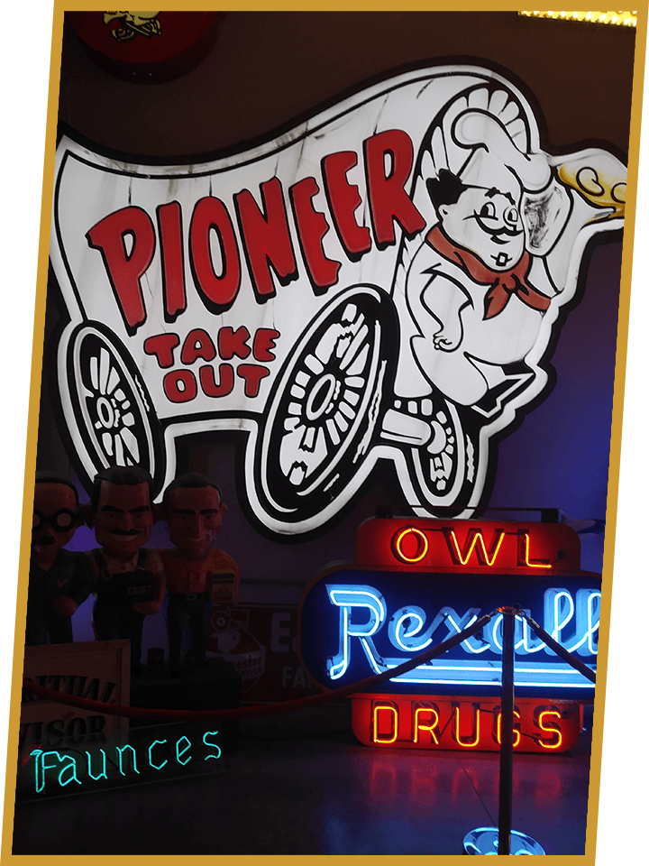 A neon sign for the pioneer take out restaurant