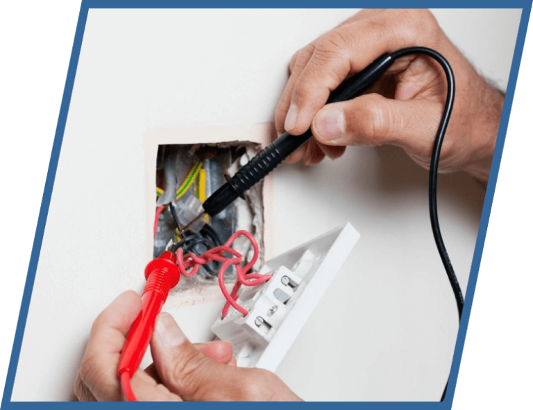 A person is using a multimeter to test an electrical outlet.